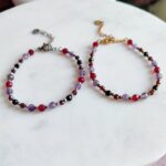 Bransoletka znak zodiaku Skorpion - Ametyst, Hematyt, Turmalin czarny, Granat i Jadeit Rubinowy 1 Delikatne bransoletki z kamieni naturalnych ze złotym i srebrnym wykończeniem.